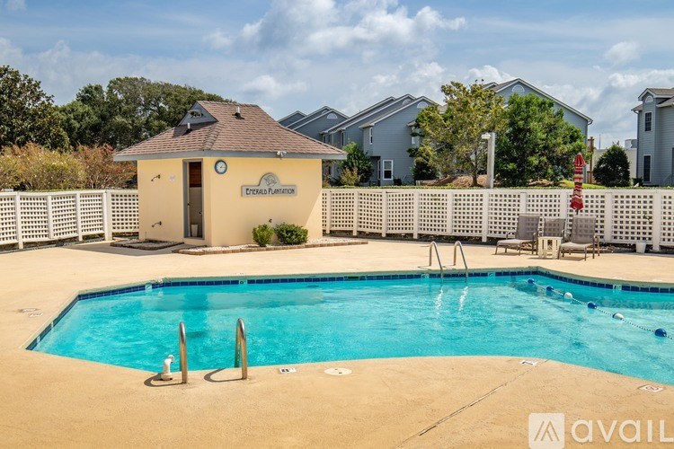 A pool with a small building next to it.