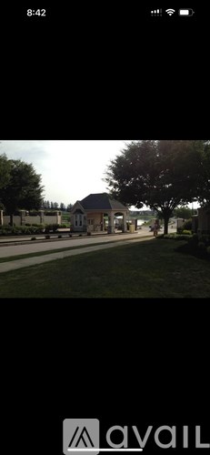 A house with a tree in front of it.