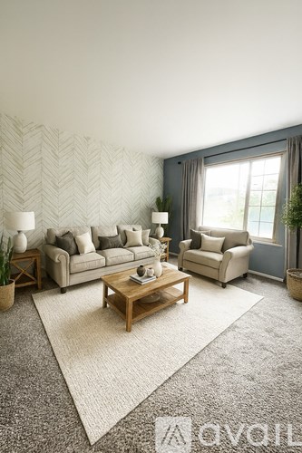 A living room with a grey carpet and a wooden coffee table.