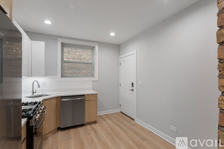 A kitchen with a white countertop and wooden cabinets.