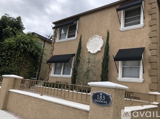 A house with a sign that says 183 Agon Avenue.