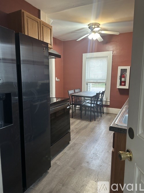 A room with grey carpet and a white ceiling.