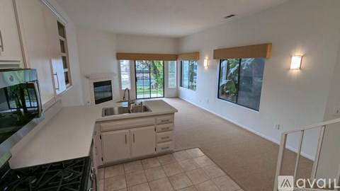 A kitchen with a stove top oven and a microwave.