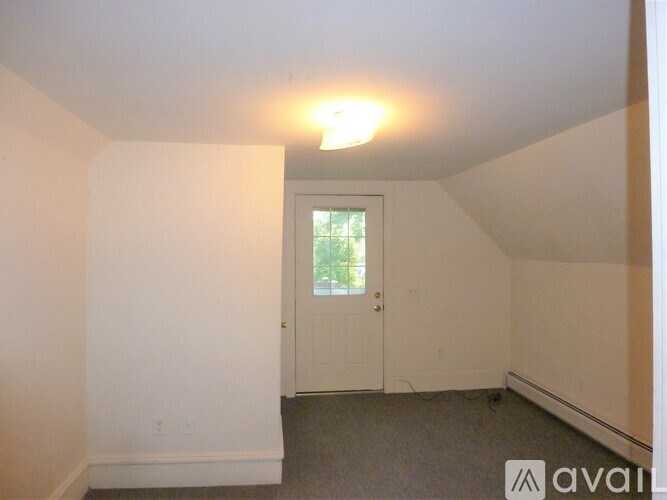 A room with a door and a window.