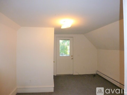 A room with a door and a window.