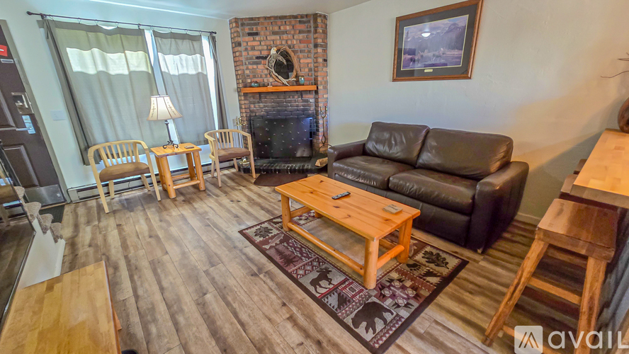 A living room with a fireplace and a couch.