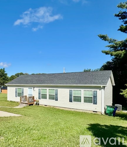 A house with a blue sky in the background.
