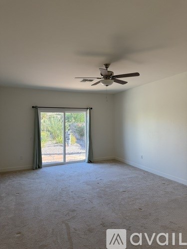 A bathroom with a sink, mirror, and wooden cabinets.