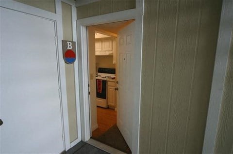 a doorway to a kitchen with a sign on the door