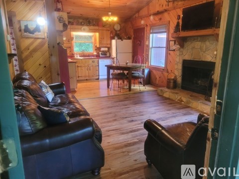 A living room with a couch and a fireplace.