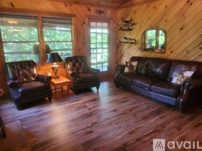 A living room with wooden floors and furniture.
