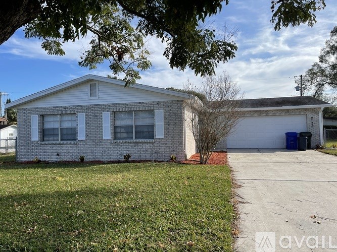 A house with a white garage door is for sale.