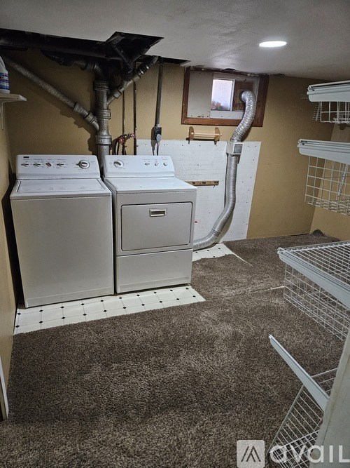 A laundry room with a washer and dryer.