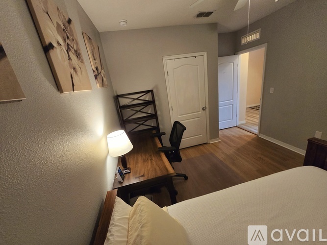 A kitchen with a refrigerator, microwave, and oven is available for rent.