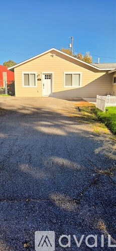 A house with a driveway in front of it.