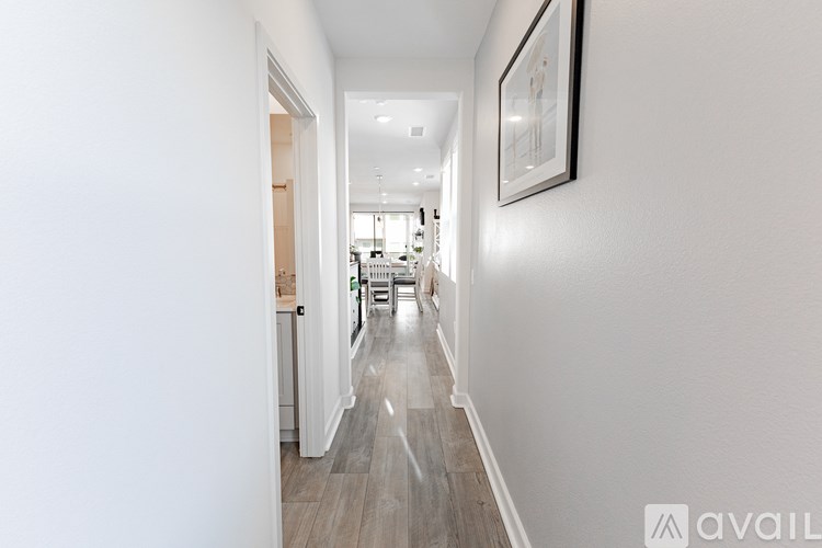 A gym with a variety of equipment including treadmills, weights, and exercise machines.