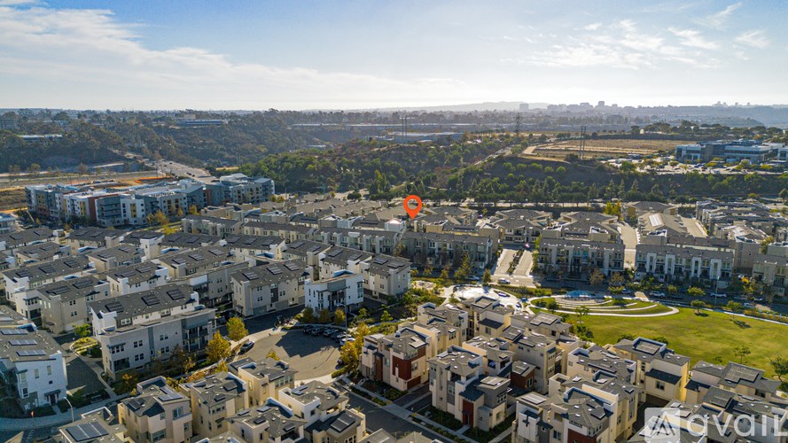 A bird's eye view of a residential area with houses and buildings.