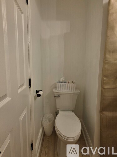 A kitchen with white cabinets and a countertop.