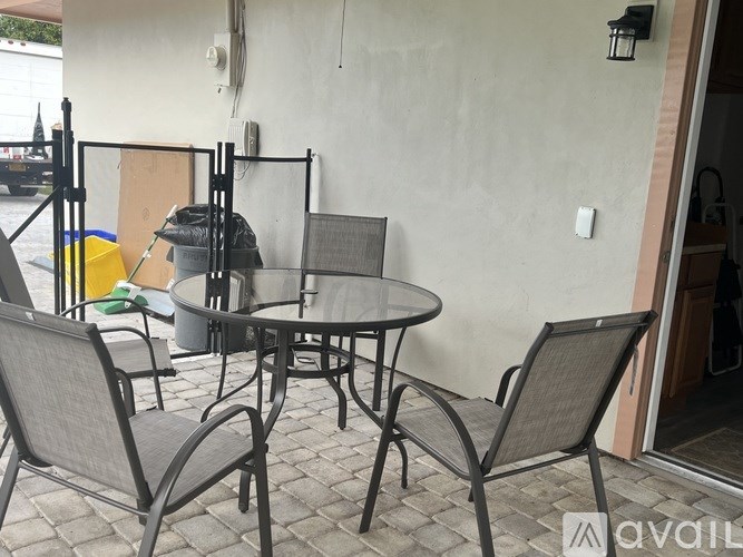 A patio table with four chairs.