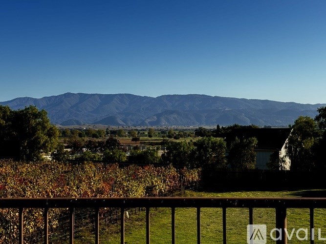 A mountain range is in the background of a beautiful landscape.