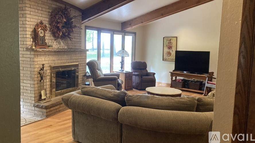 A living room with a fireplace and a couch.