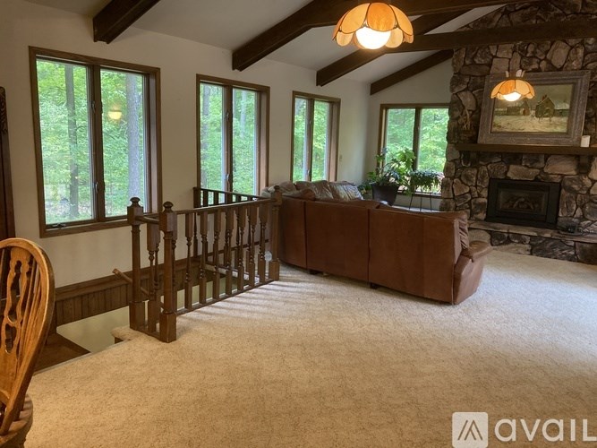 A living room with a fireplace and a couch.