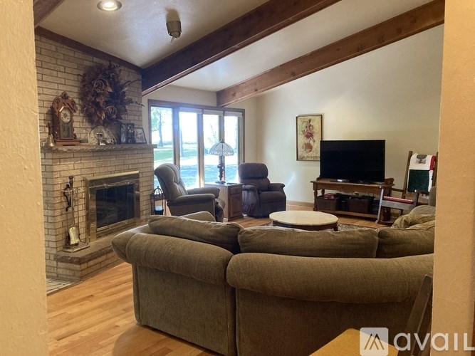 A living room with a fireplace and a couch.
