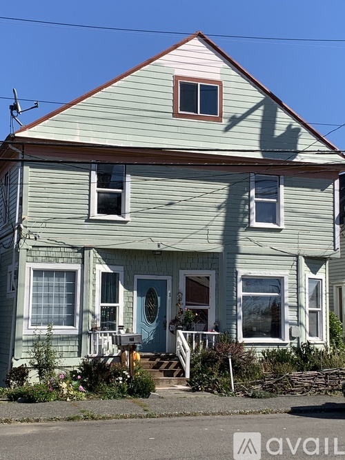 A house with a blue door and a small porch.