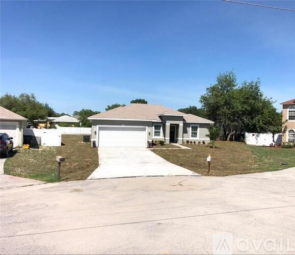 A house with a driveway in front of it.