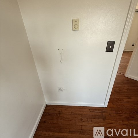 A wall socket with a switch and a light switch plate.