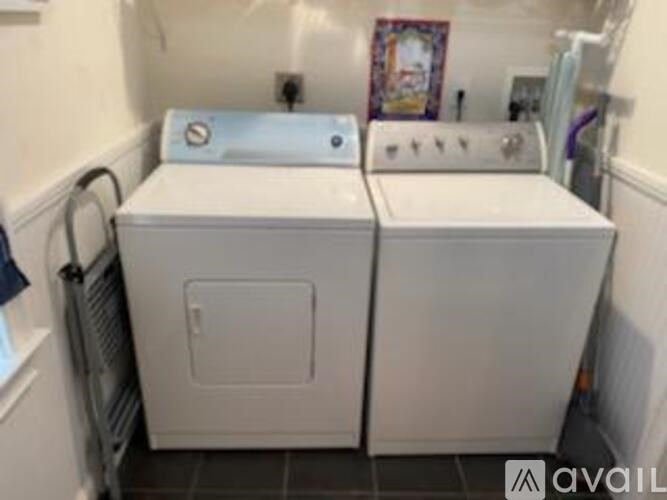 A washing machine and dryer are sitting next to each other.