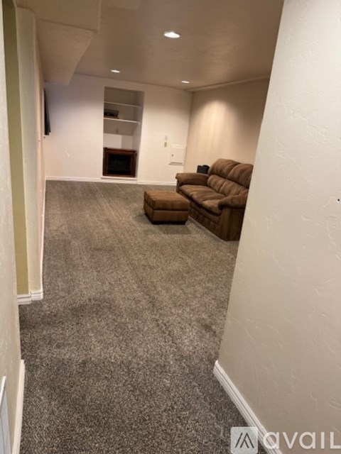 A living room with a couch and a chair.