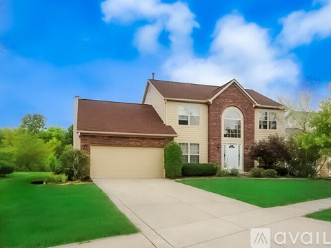A house with a brown roof and a white door is for sale.