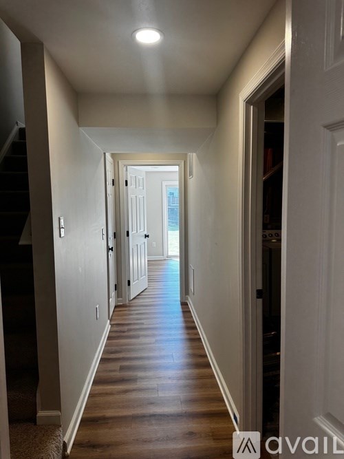 A long hallway with a light at the end.