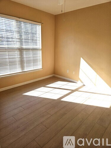 A bathroom with a tub, toilet, and sink.