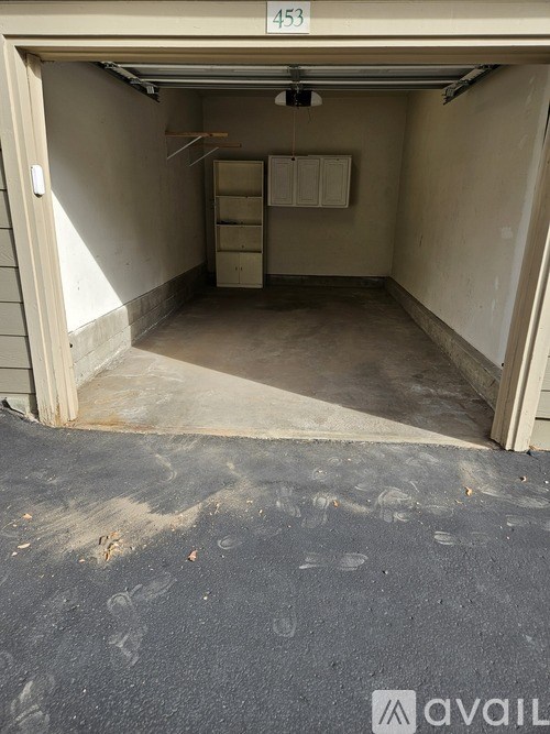 A garage with the number 453 on the wall.