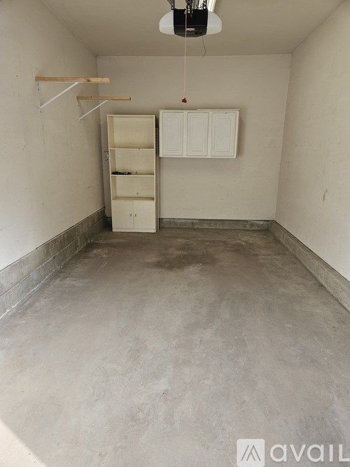 A room with a cabinet and a shelf is available for rent.