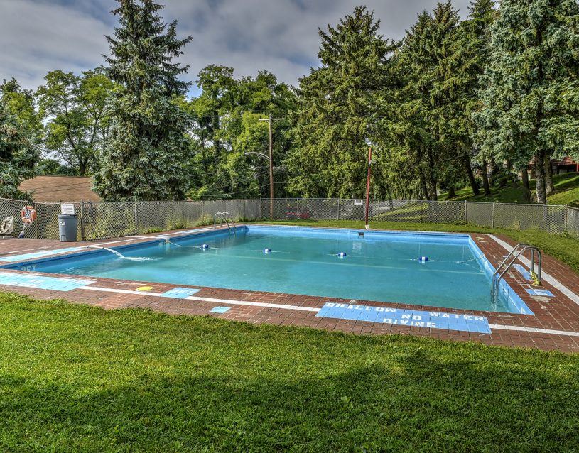 a swimming pool with a fence around it