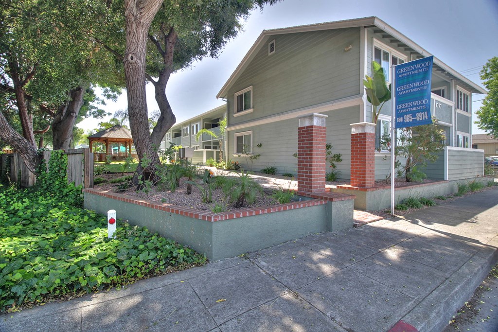 A building with a sign in front of it.