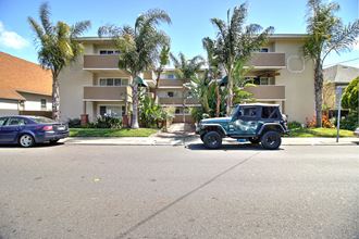 a jeep parked in front of an apartment building