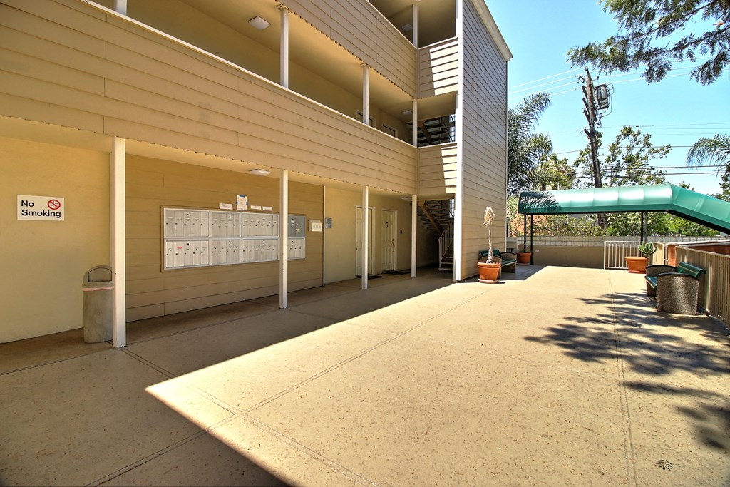 A building with a no smoking sign on the wall.