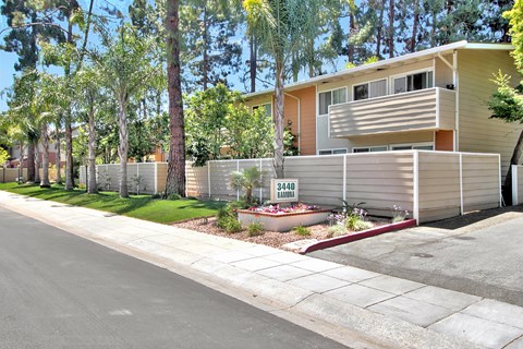 A house with a fence and a sign that says 34401 HANDLER.