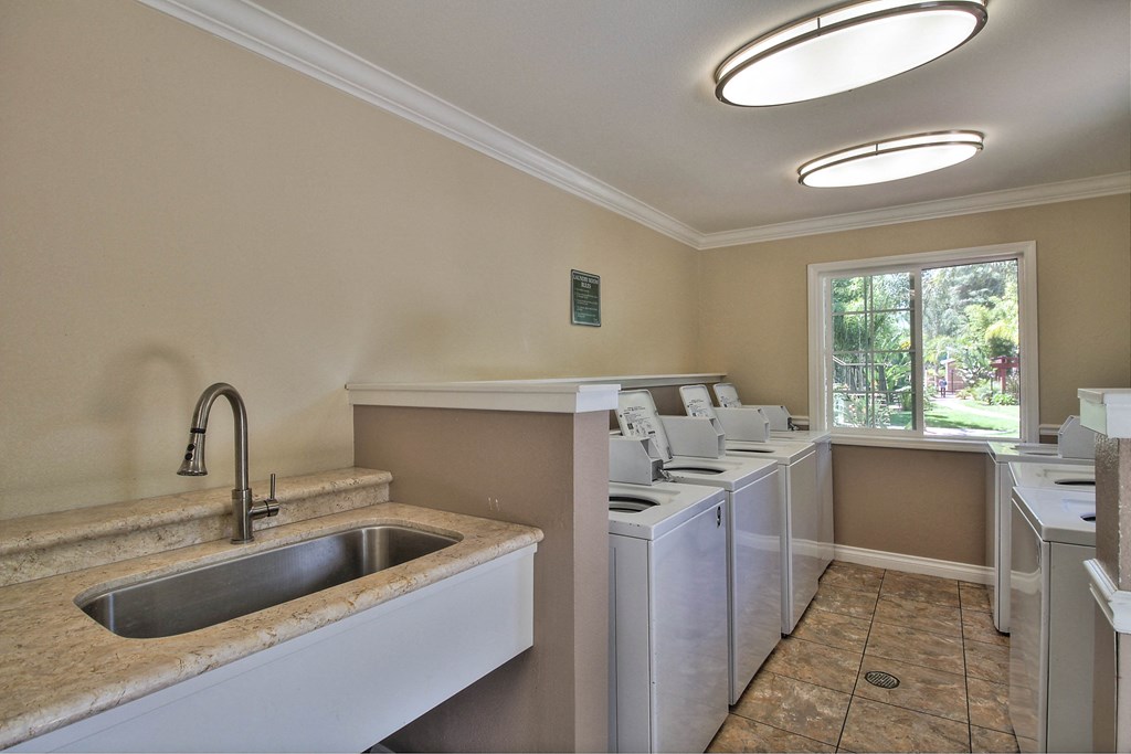Laundry Center with Machines Next to Folding Counter at Sunnyvale Town Center, Sunnyvale