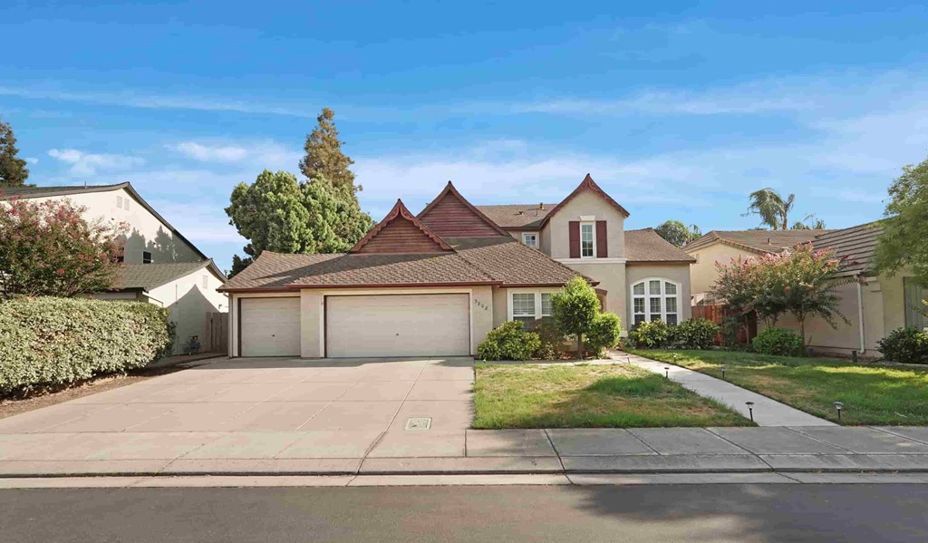 A house with a brown roof and a white garage door.