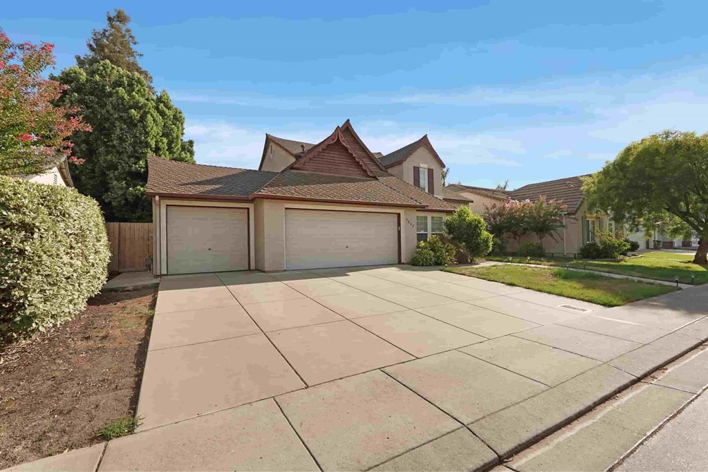 A house with a brown roof and a garage door.