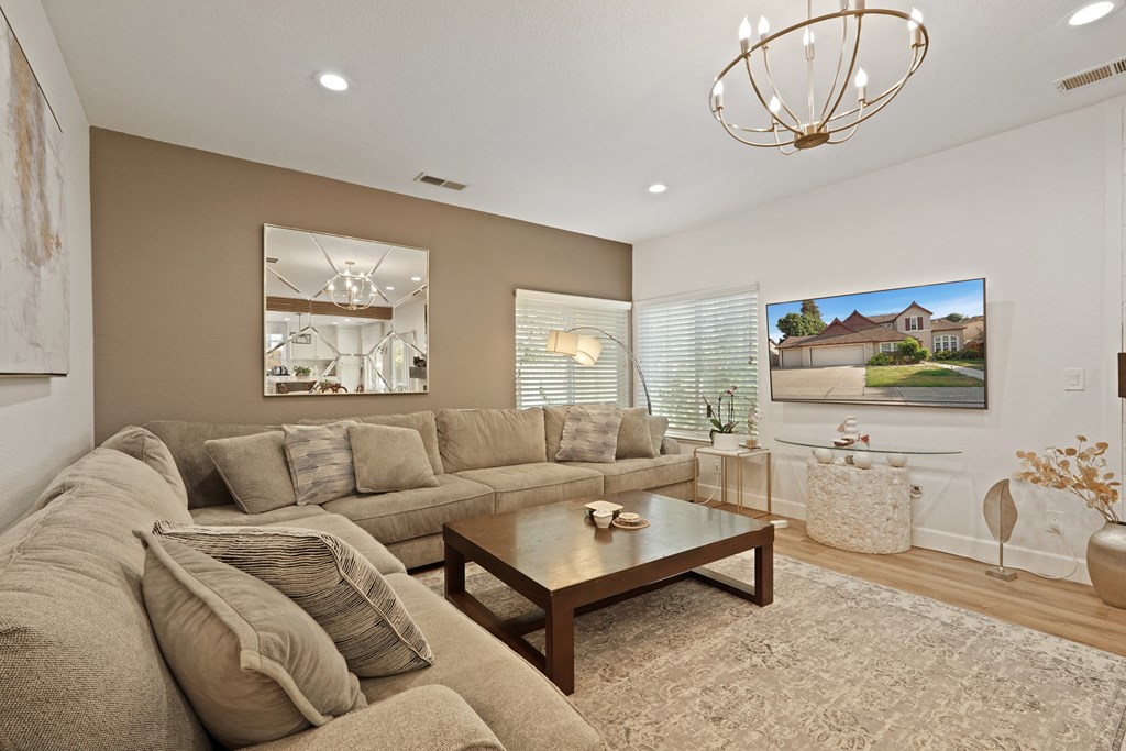 A living room with a large couch and a coffee table.