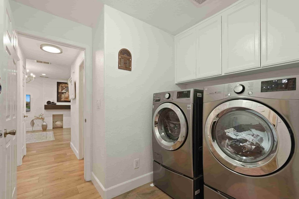 A laundry room with a washer and dryer.