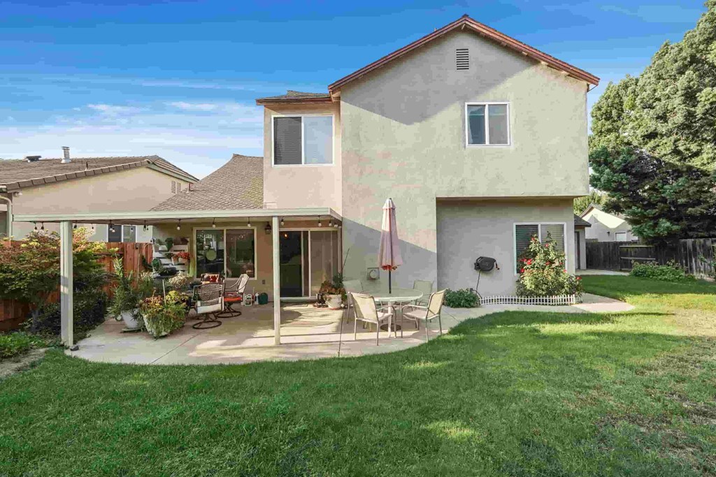 A house with a patio and a flag.