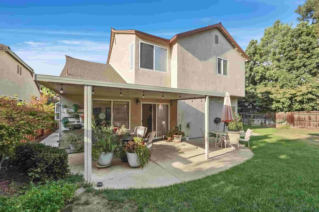 A house with a patio and a garden.