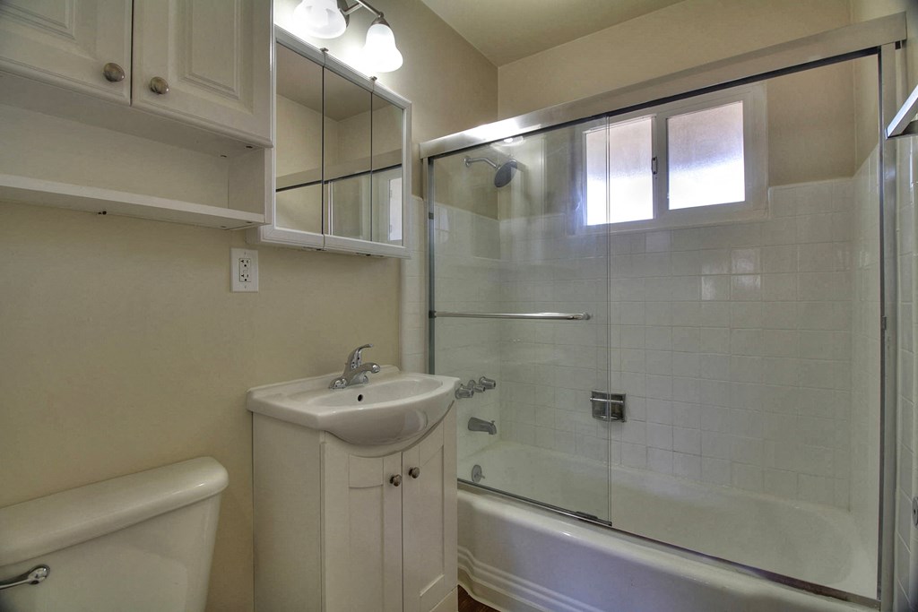 a bathroom with a sink and a shower